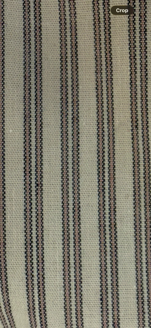 Textured fabric with vertical stripes in beige and brown.