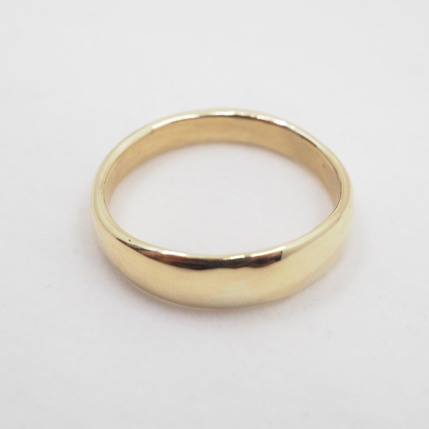 Gold ring on a white background