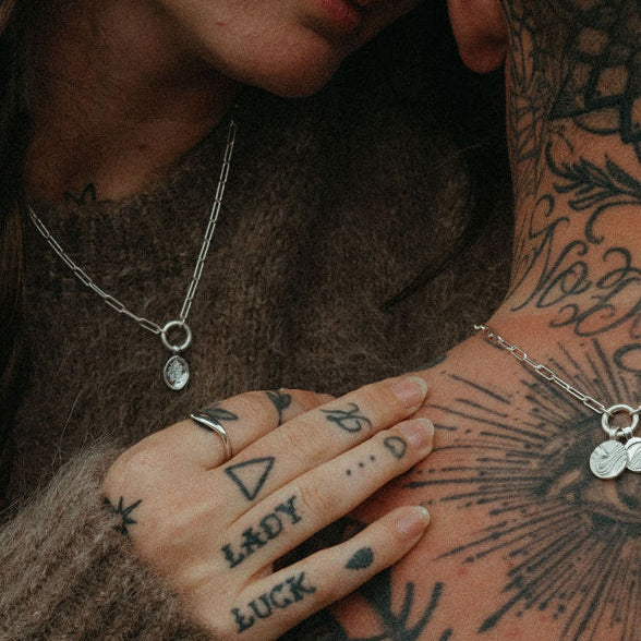 Couple embracing with tattoos on their skin
